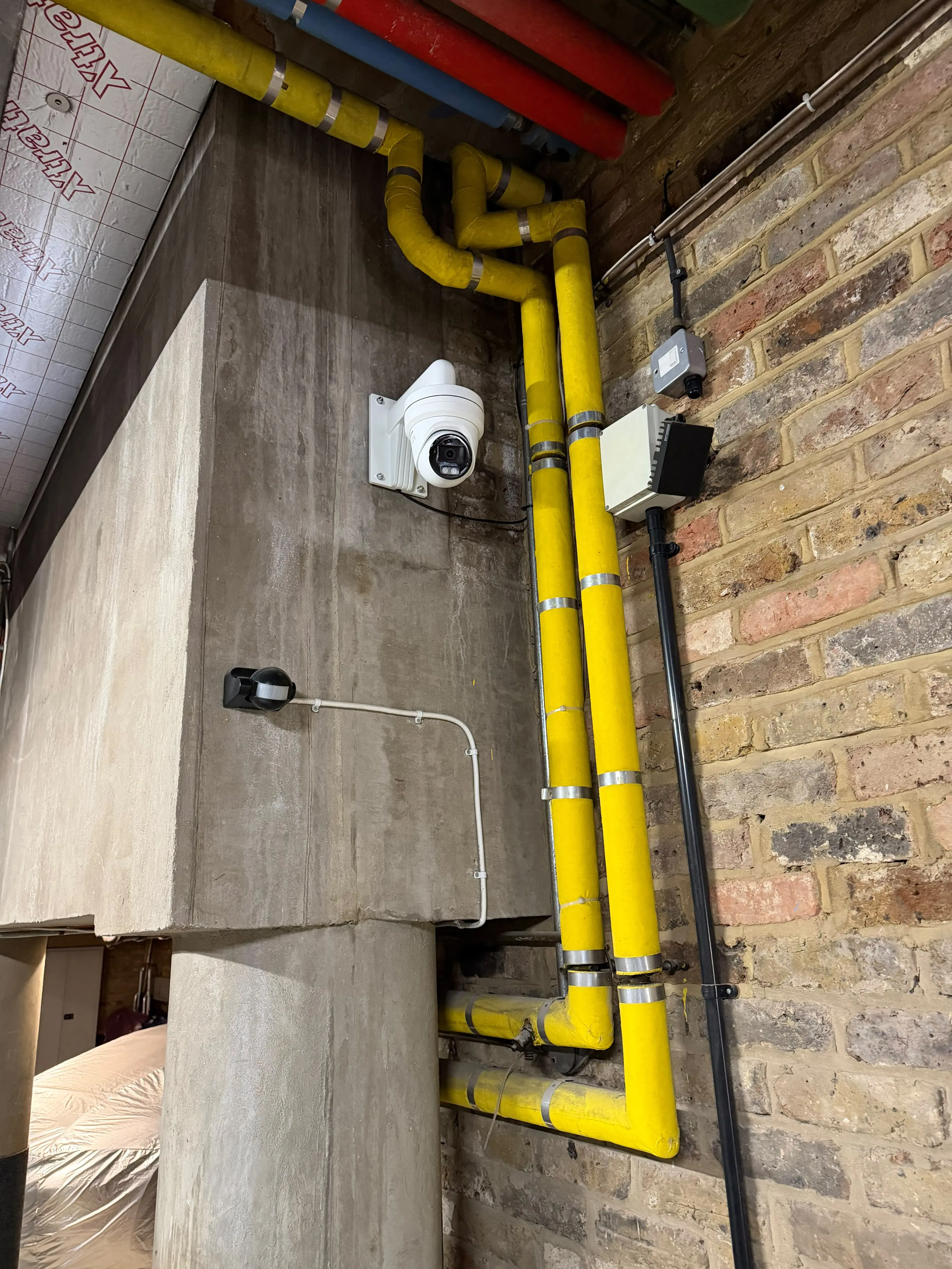 Turret camera installed in a basement plant room
