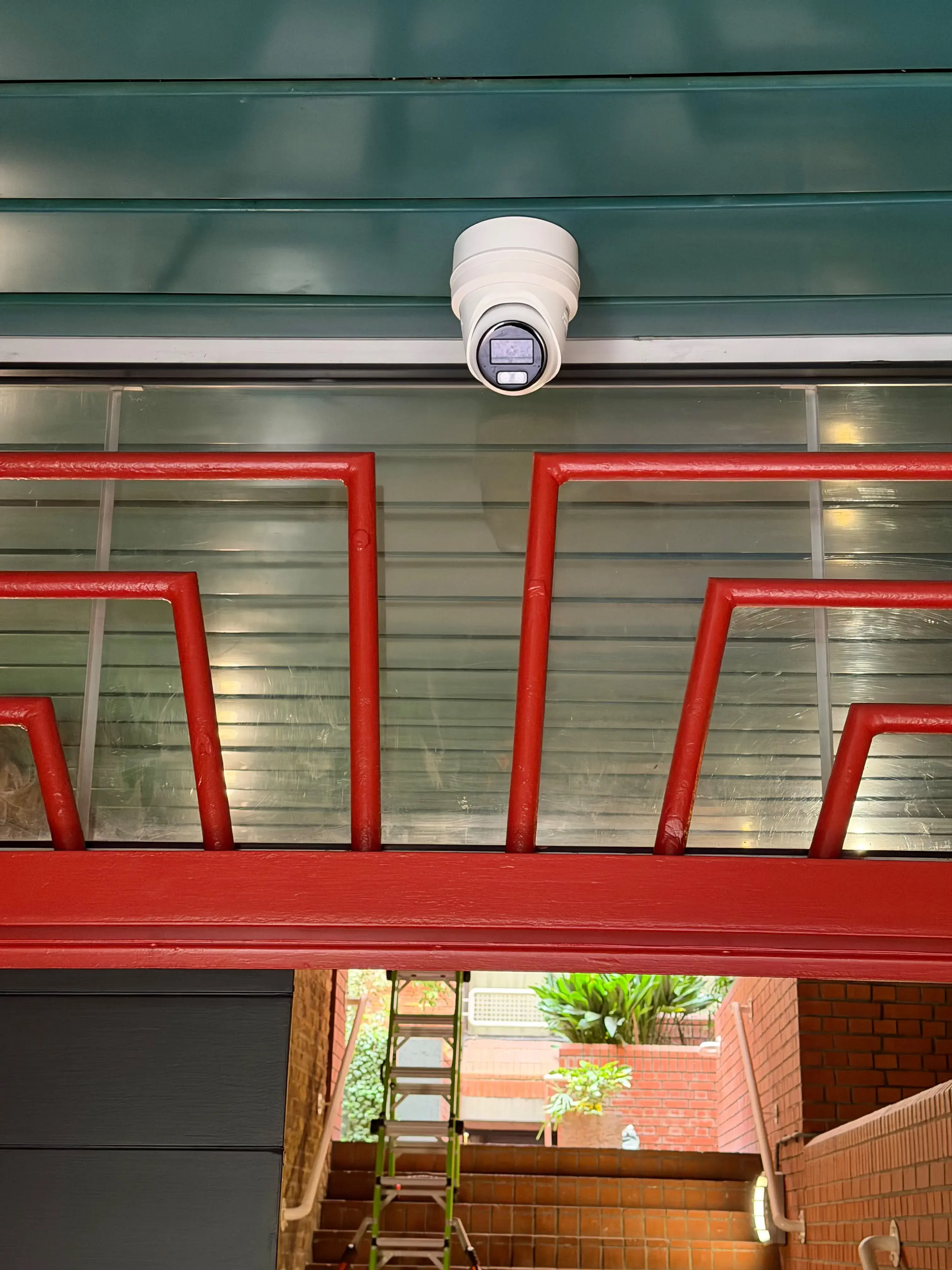 Turret camera above a communal entrance gate