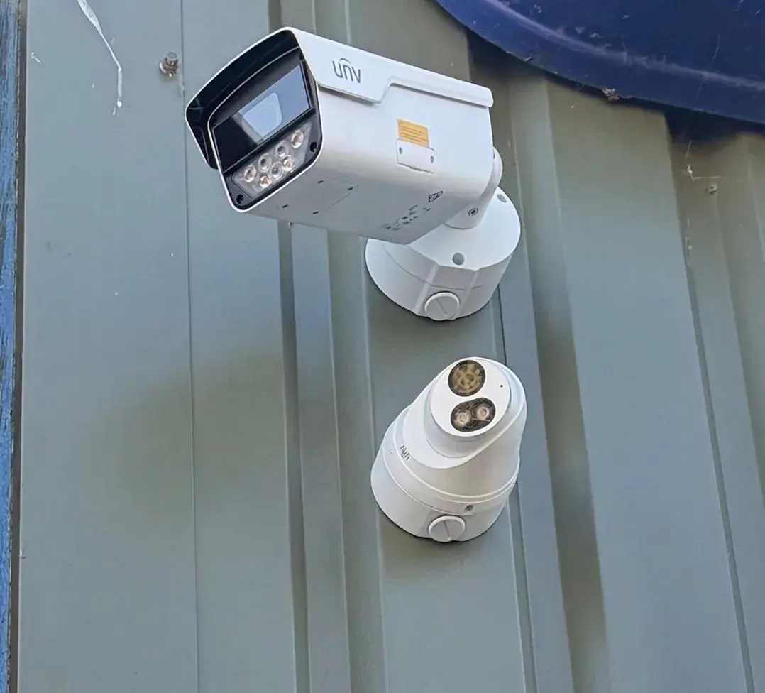 Uniview bullet and turret CCTV cameras installed on metal wall cladding