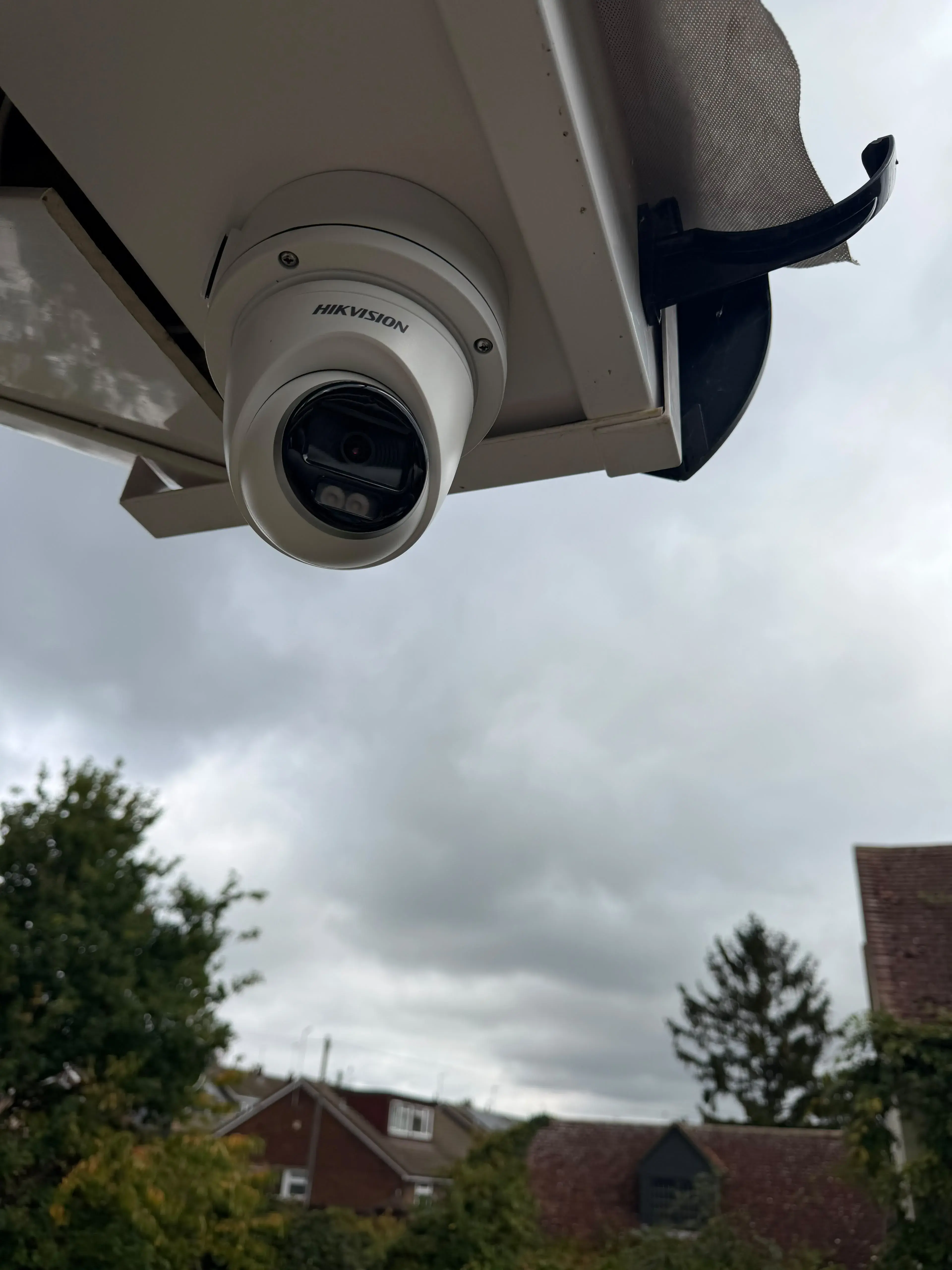 Hikvision turret camera mounted under a roof edge