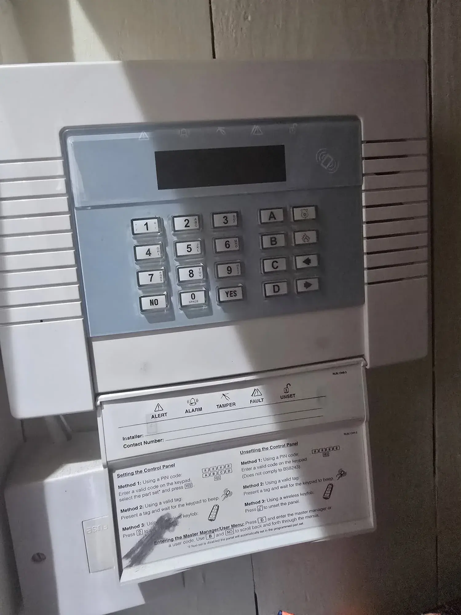 Wall-mounted intruder alarm control panel