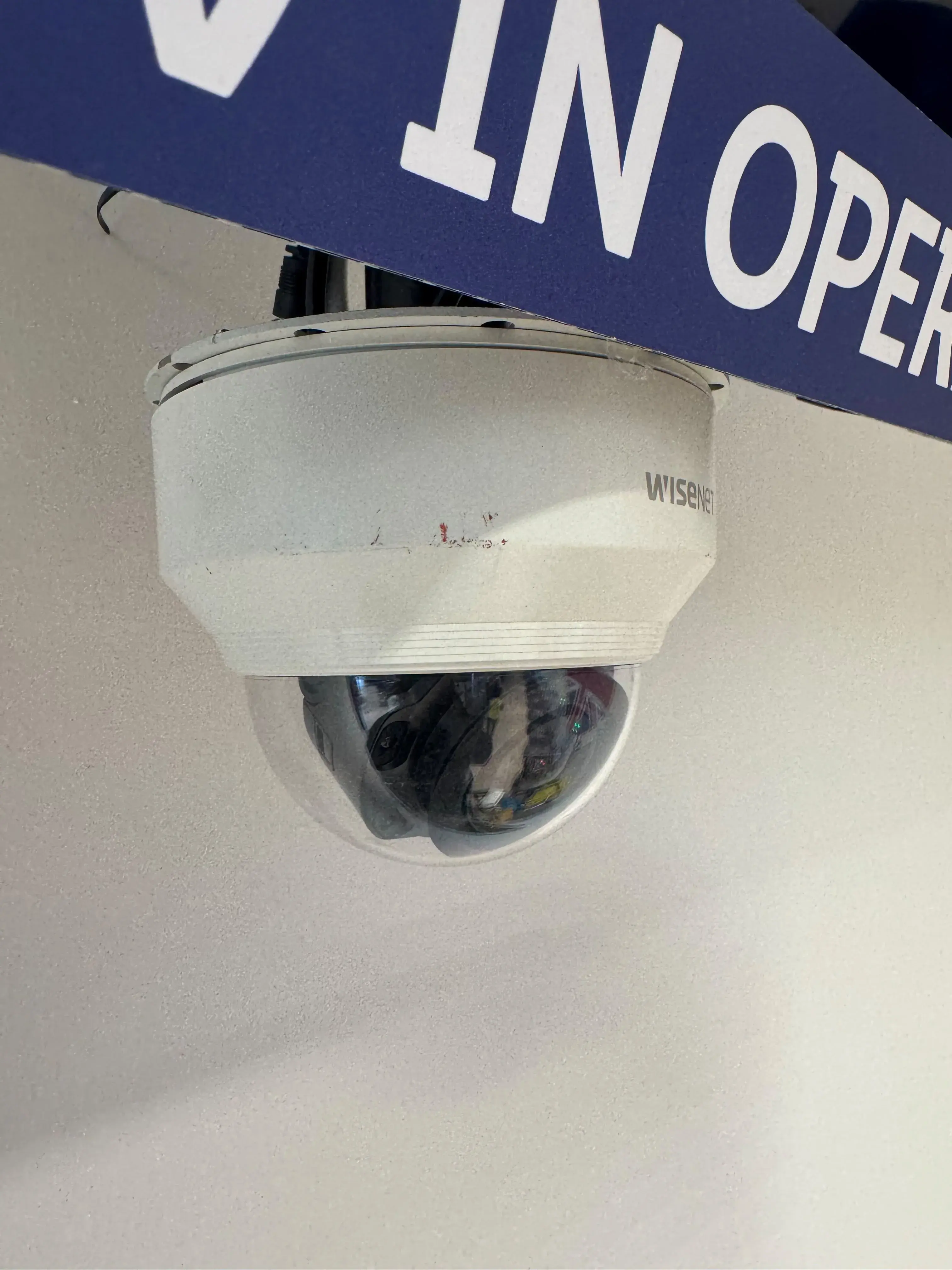 Close-up of a retail dome CCTV camera