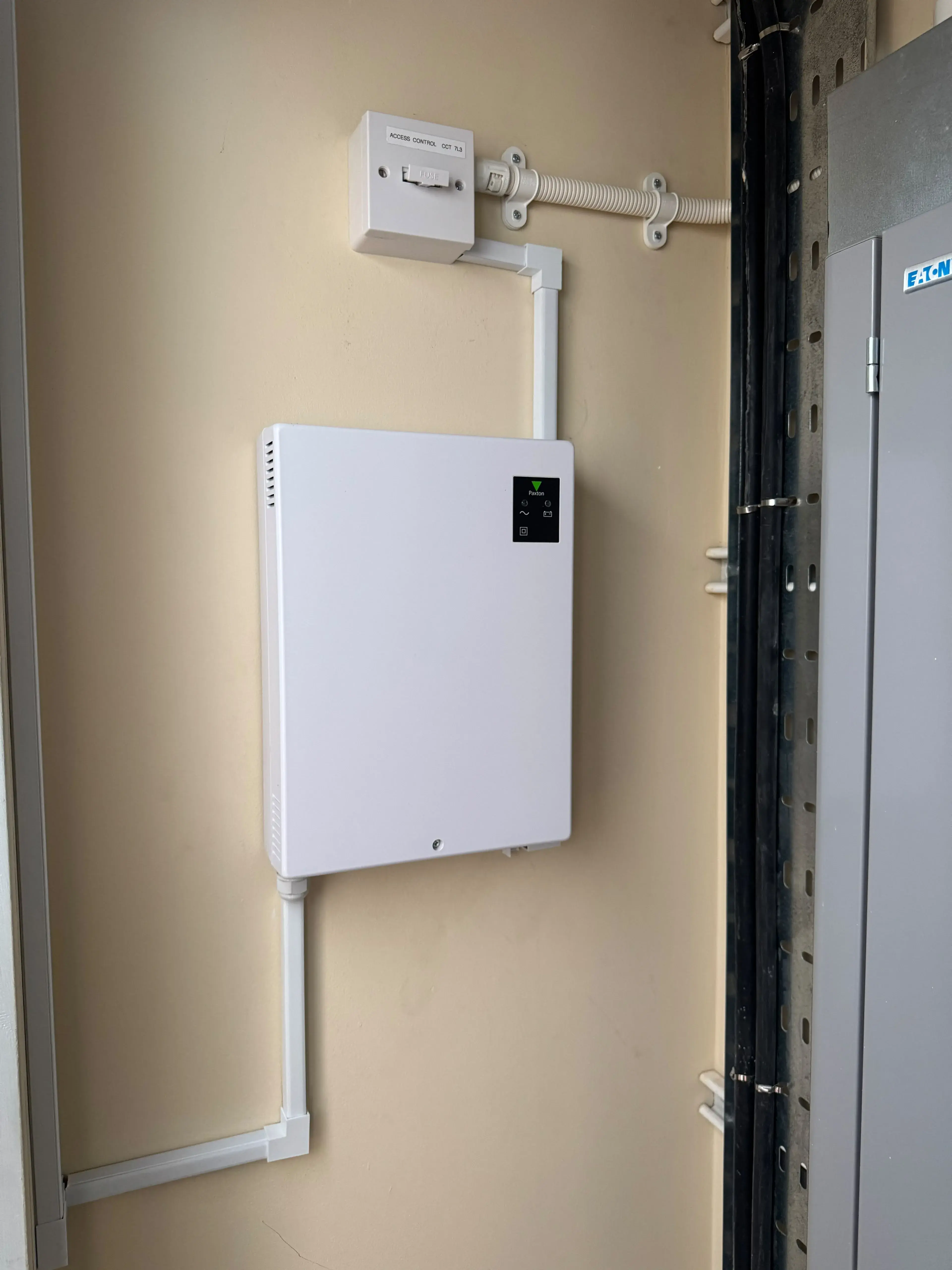 Wall-mounted security control panel with neat trunking